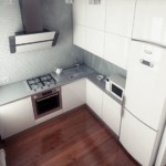 Hotte inclinée sur le mur de la cuisine avec de fins carreaux