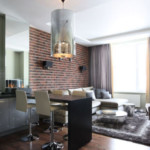 Brick wall behind the sofa in the living room