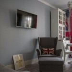 Black tv on gray wall