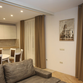 Blackout curtains on the windows of the living room kitchen