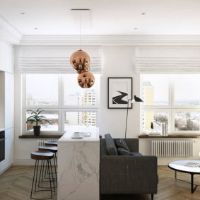 Bright curtains on the windows of the kitchen-living room