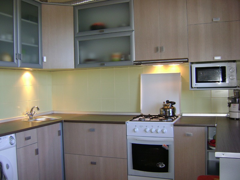 White gas stove in the corner kitchen