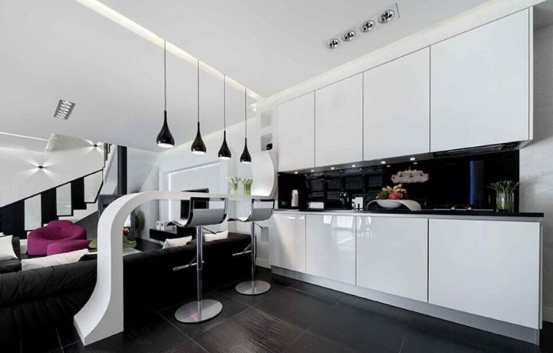 White furniture in a high-tech kitchen-living room