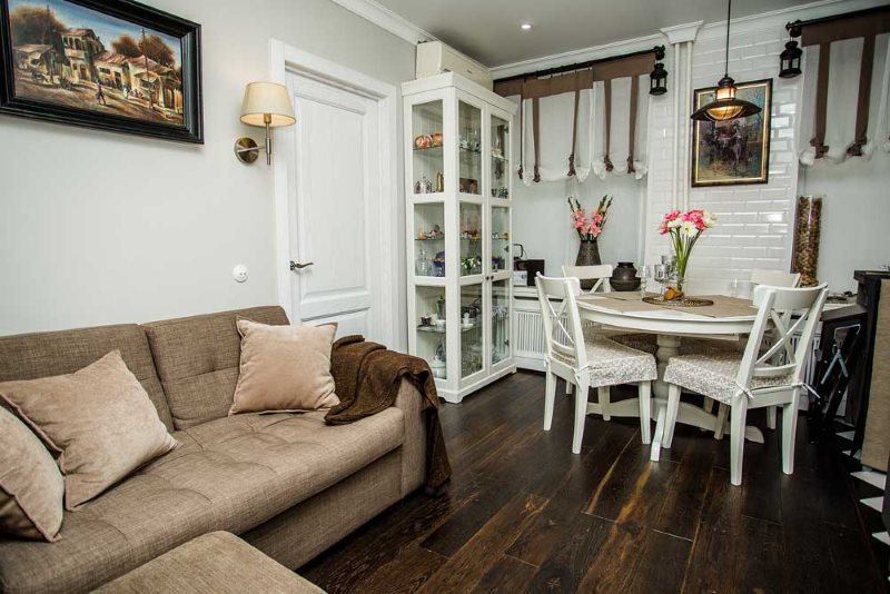 Dark floor from planed boards in the kitchen-living room