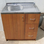 Stainless steel sink on the kitchen table