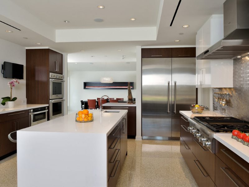 Two-row modern kitchen with an island in a city apartment