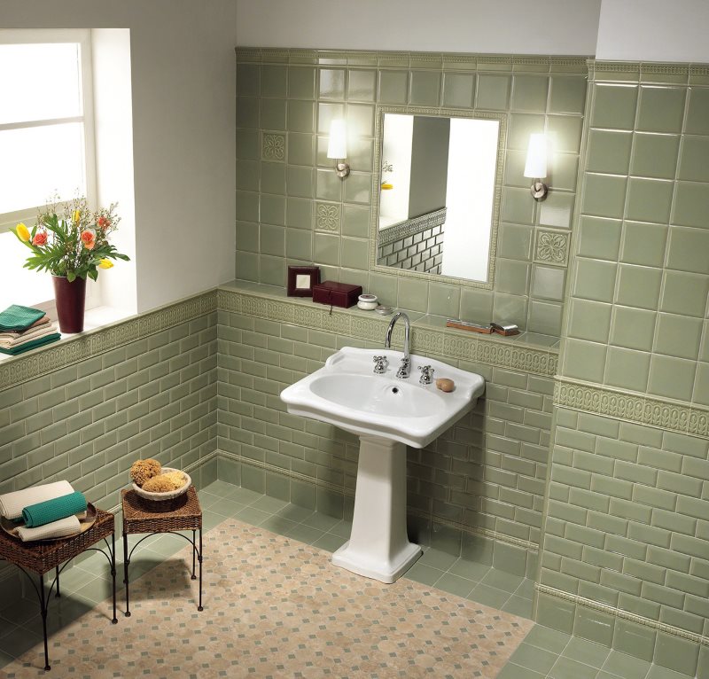 White washbasin in the bathroom of a private house with a window