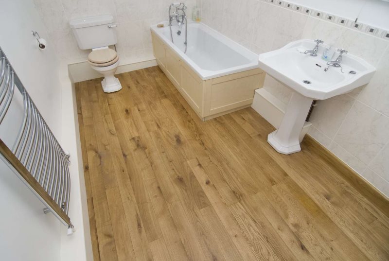Ash floor in the bathroom of a wooden house
