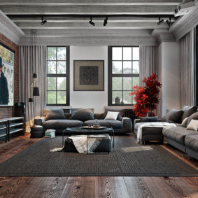 Dos sofás en una sala de estar de estilo industrial.