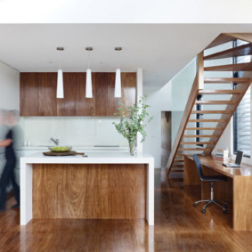 Wooden staircase in the kitchen-dining room