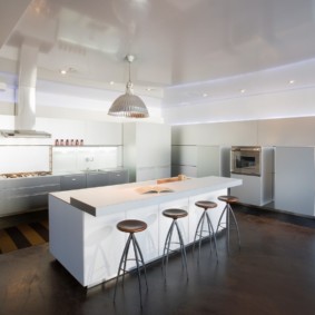 White furniture on a dark kitchen floor