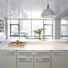 White kitchen with a large window