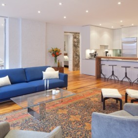 Blue sofa on the laminate floor