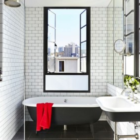 Red towel as an accent in the bathroom interior