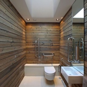 Narrow bathroom with a window in the ceiling