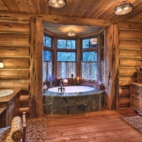Bath in the bay window of the log house