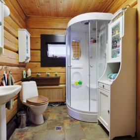 Stone tiles on the bathroom floor in a private house
