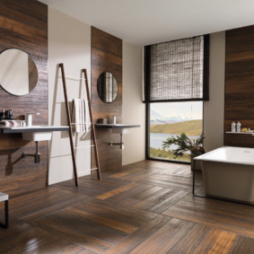 Parquet floor in the bathroom with a large window