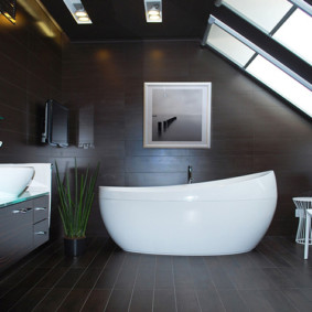 White bath in a room with dark walls