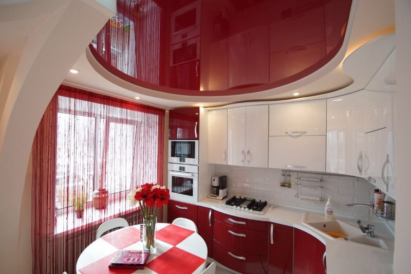 Red stretch ceiling in a modern kitchen