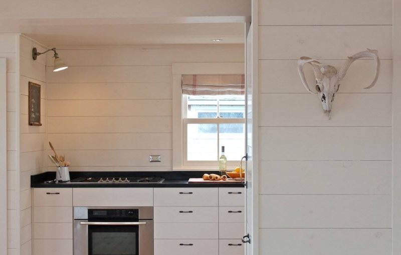 Bright MDF panels on the wall of the kitchen of a private house