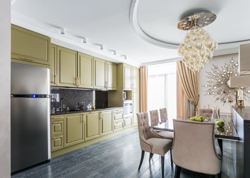 Massive chandelier on the two-level ceiling of the kitchen
