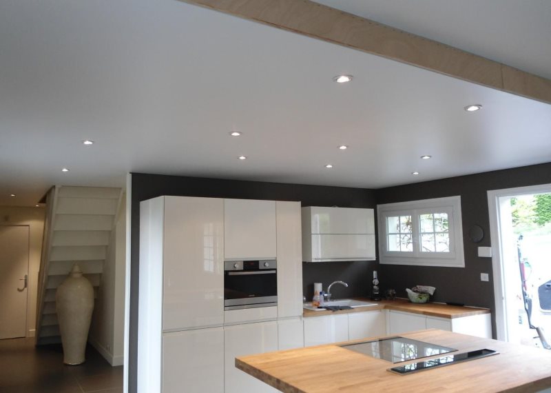 Satin ceiling in the interior of the kitchen of a private house