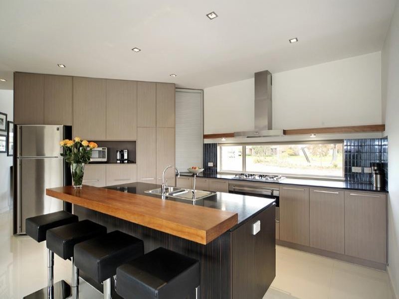 Wooden countertop of a bar counter on a kitchen island