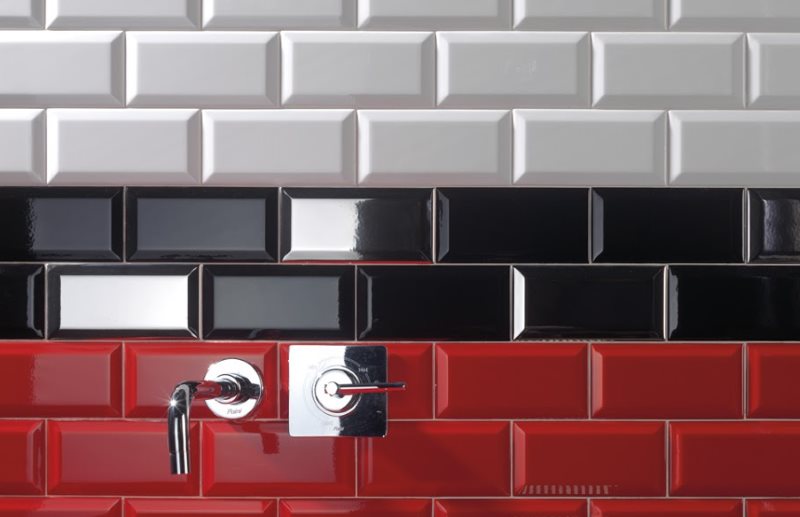 Colored tile boar on the wall of the combined bathroom