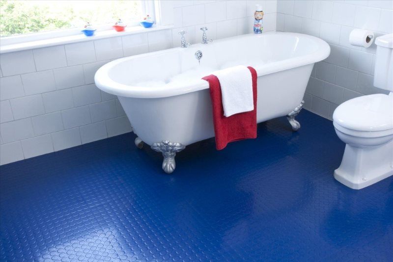 Blue floor in the interior of the bathroom of a country house