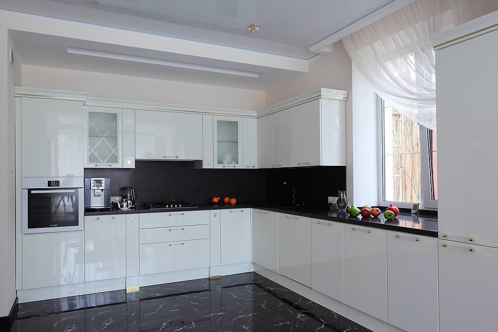 White curtain on the kitchen window with black floor