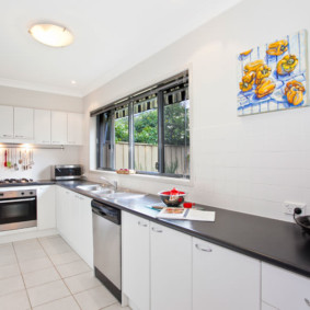 The working area of the kitchen in front of the window in a private house