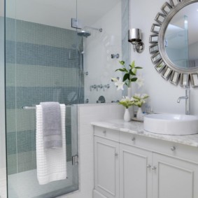 Glass hinged door of a shower cabin