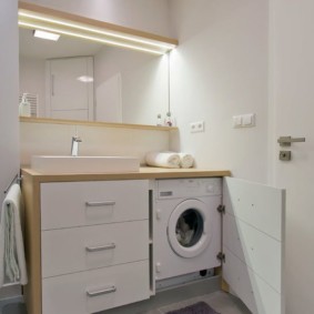 Cabinet for a washing machine in the bathroom