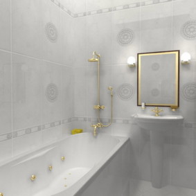 Gold plated faucet in a white bathtub