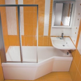 White bathtub and orange tile