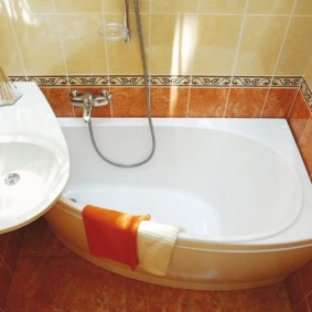 The interior of a small bathroom with compact fixtures