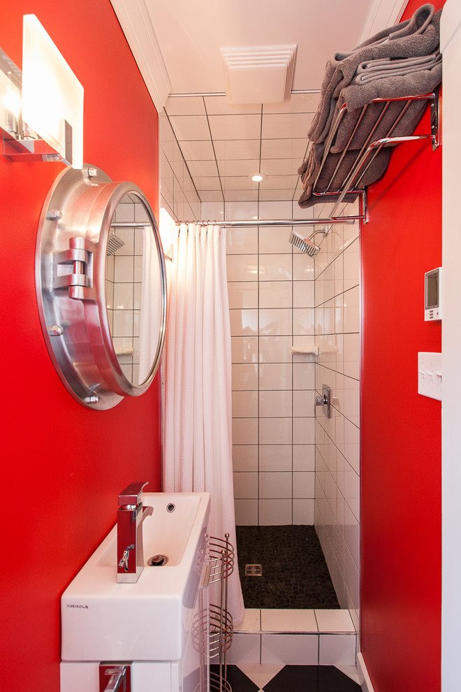Red color in the interior of a small bathroom without a toilet