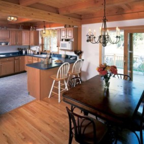 kitchen in a wooden house with access to the terrace