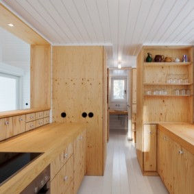 walk-through kitchen in a wooden house
