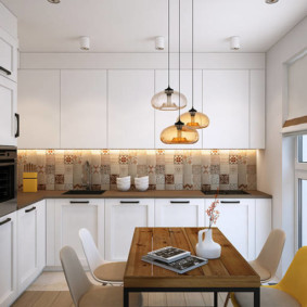 arrangement of furniture and appliances in the kitchen in white