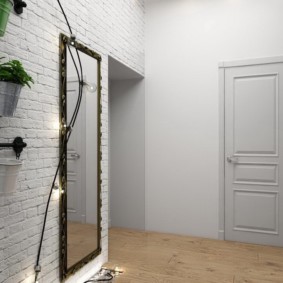 papier peint sous une brique dans le hall