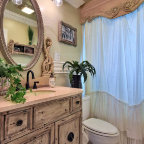 floor toilet in front of the curtains in the bathroom