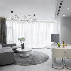 Translucent curtains on the windows of the living room