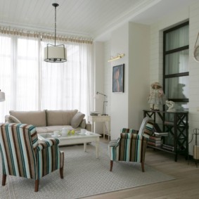 Upholstered armchairs with striped upholstery