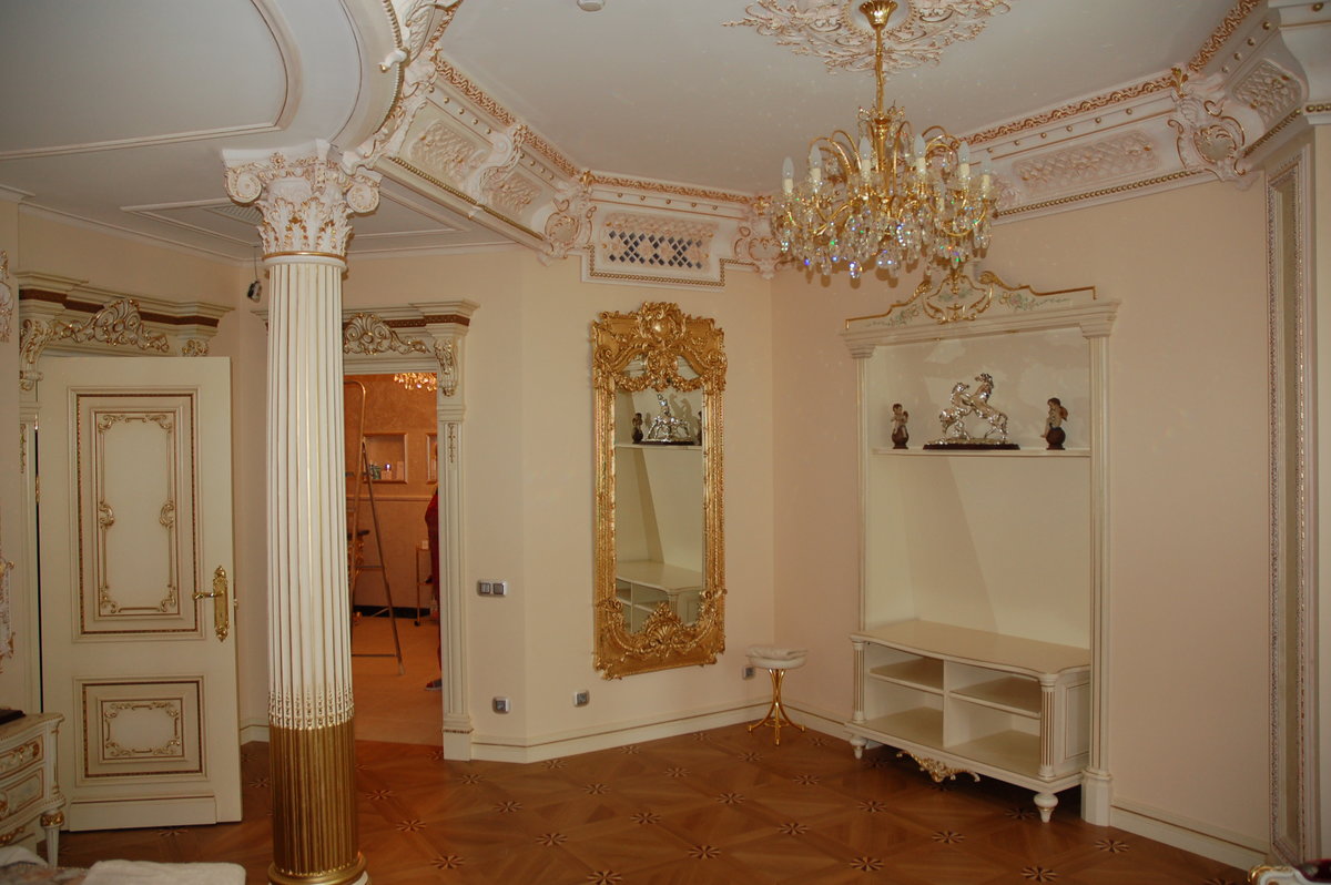 stucco molding on the ceiling and walls