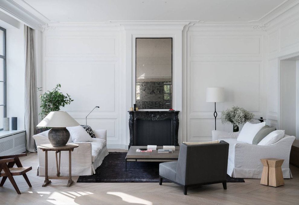 Mirror above the fireplace in the bright living room