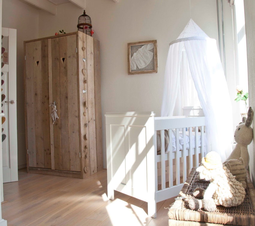 White organza canopy over newborn's bed