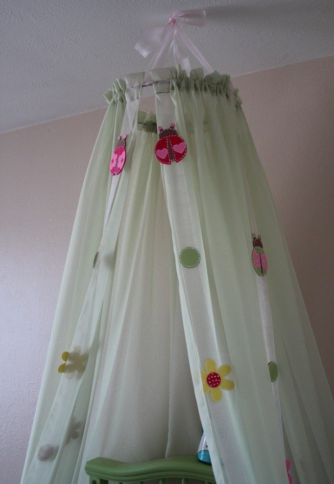 Canopy with ribbons over the girls bed