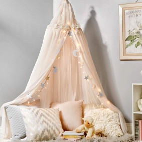 Garland with small bulbs on a children's canopy